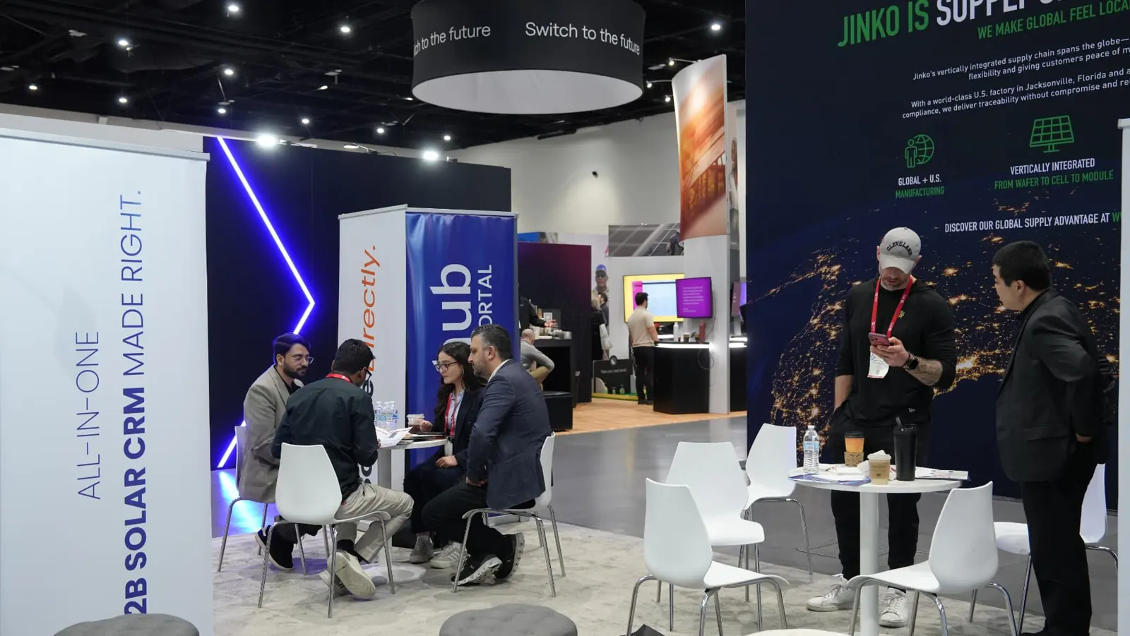 Wide view of the Sunhub booth lounge during meetings at Intersolar
